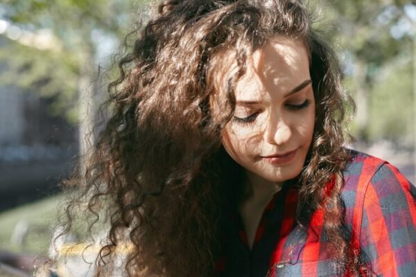 Frizzy, wavy hair with volume.